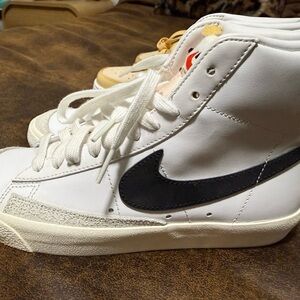 Nike White High-Top Sneakers with Black Swoosh